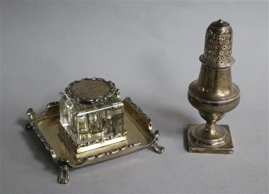 An Edwardian silver ink stand with silver mounted glass well and a silver pepperette.